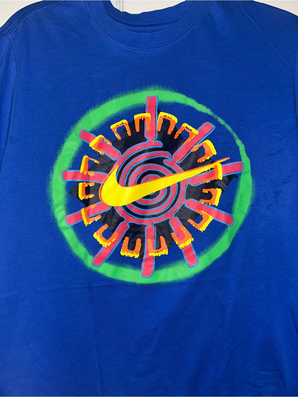 Nike Blue Short Sleeve Tee with Yellow Swoosh and Multicolor Graphic